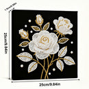 Decorative panel with floral design on a black background, featuring white and gold roses.