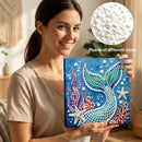 Woman holding a completed mermaid-themed craft project with beads, inset showing different bead sizes.