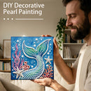 Man holding a DIY decorative pearl painting of a mermaid tail with text 'DIY Decorative Pearl Painting'.