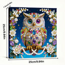 Decorative owl with gemstones and pearls on a blue background, with dimensions indicated.
