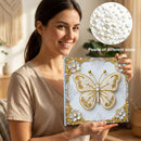 Woman holding a butterfly art piece made of pearls with close-up of pearls inset.