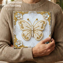 Person holding a completed DIY decorative pearl painting of a butterfly