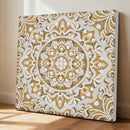 Decorative wall art with gold and white pattern on a plain background
