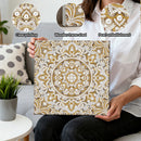 Person holding a decorative wall art piece with pearl embellishments, showing close-up details.