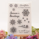Set of clear stamps with snowflake designs and winter-themed text on a white background.