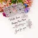 Clear stamp set with floral and text designs on a white background with flowers.