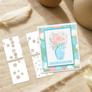 Card with floral design and decorative elements on a textured surface