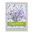 Greeting card with purple crocus flowers and 'Congratulations' text on a floral patterned background.