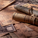 Vintage-style paper scrolls and documents with text and stamps on a textured surface.