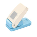 Blue and beige paper punch on a white background