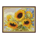Cross-stitched sunflowers in a wooden frame on a white background