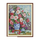 Framed artwork of a floral arrangement with a blue vase on a white background