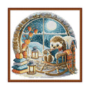Hedgehog reading a book by a window with pumpkins and lanterns, framed artwork.