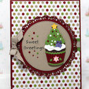 Christmas-themed card with a cupcake design on a polka dot background