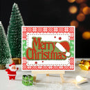 Christmas card with 'Merry Christmas' text, Santa figurine, and decorative trees on a festive background.