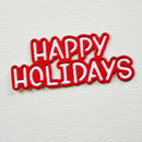 Red and white 'Happy Holidays' patch on a textured white background