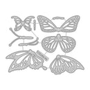 Set of butterfly-shaped metal cutting dies on a white background
