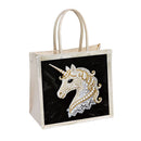 Beige tote bag with a unicorn design on a black background