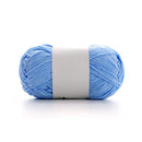Light blue skein of yarn with a white label on a white background