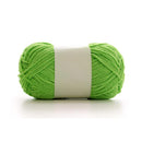 Green skein of yarn on a white background