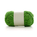 Green ball of yarn with a white label on a white background
