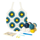 Crocheted pot holder with floral pattern, yarn balls, crochet hook, and instructions on a white background