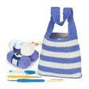 Crocheted bag with yarn and hooks on a white background