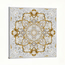Decorative wall art with gold and white floral patterns on a gray background