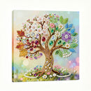 Decorative wall art of a tree with colorful gemstones on a white background
