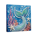 Canvas painting with a mermaid tail, starfish, and coral on a blue background