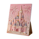 Decorative card with a castle design and fireworks on a pink background