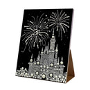 Decorative card with a castle and fireworks design on a black background
