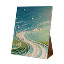 Decorative greeting card with pearl embellishments on a white background