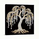 Decorative wall art of a tree made from pearls and gold beads on a black background
