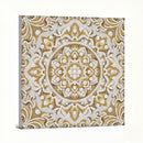 Decorative wall art with gold and white intricate pattern on a light background