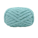Teal skein of yarn on a white background