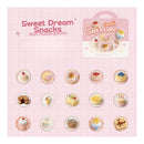 Packaging of 'Sweet Dream Snacks' soft plushies with various dessert illustrations on a pink grid background.
