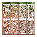 Decorative metal screens with floral and leaf patterns on a wooden background