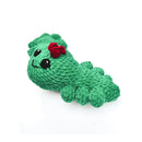 Green plush toy with a red bow on a white background