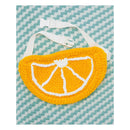 Crocheted orange slice bag on a blue and white striped background