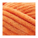 Close-up of orange yarn on a white background