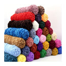 Stack of colorful yarn balls on a white background