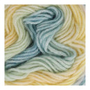 Close-up of multicolored yarn with blue, green, and beige tones.