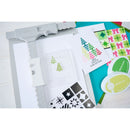Stencils and stamp set with a Sizzix machine on a white background
