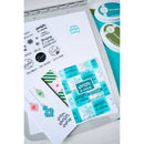 Collection of winter-themed stamps and dies on a white background