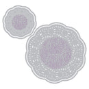Two gray doilies with purple centers on a white background