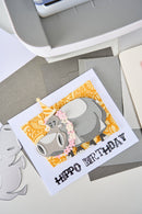 Hippo birthday card with decorative elements on a printer bed