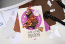 Personalized greeting card with wizard design and text on a craft table.