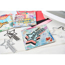 Colorful greeting cards with star designs on a white surface