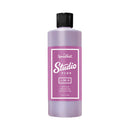 Purple bottle with black cap labeled 'Speedball Studio Plus' on a white background